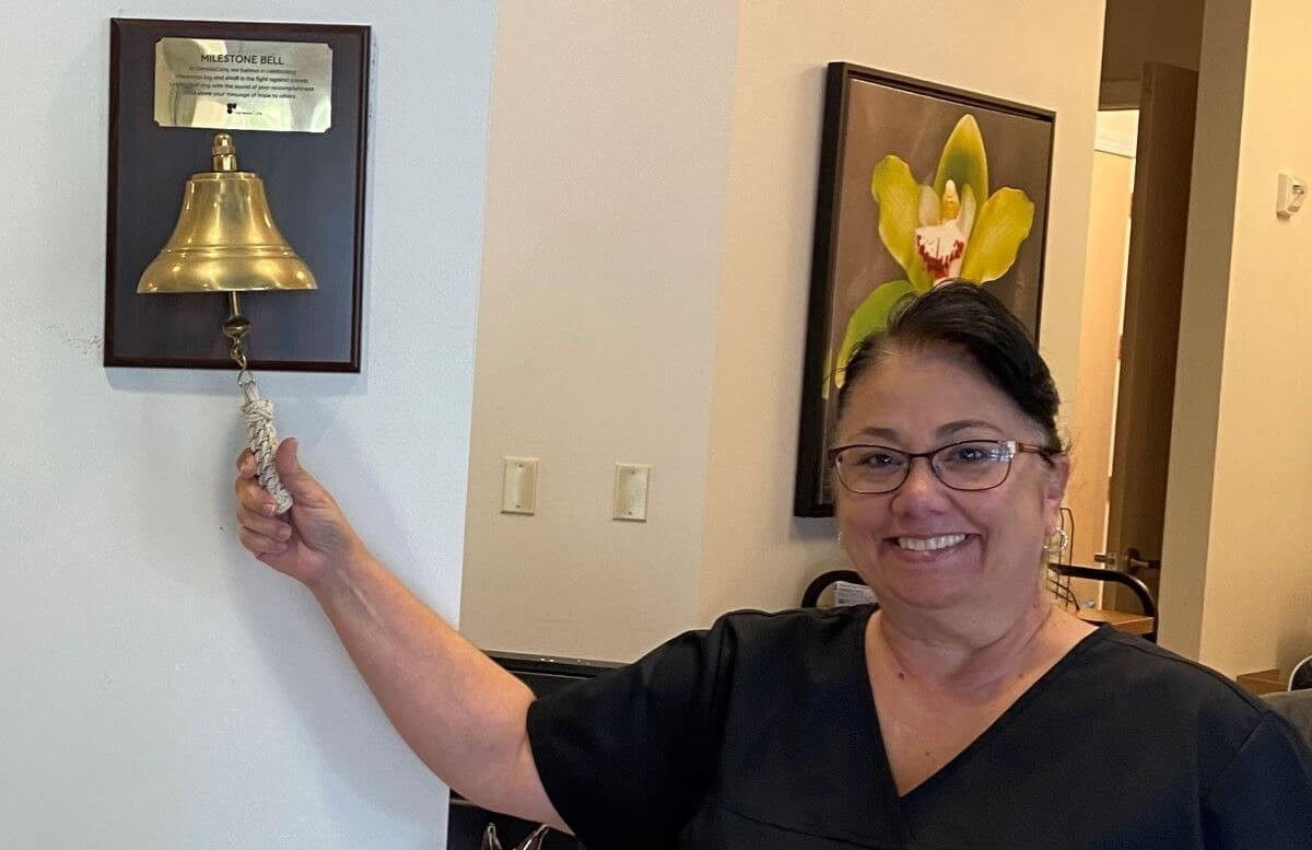 Sandy ringing the cancer free bell