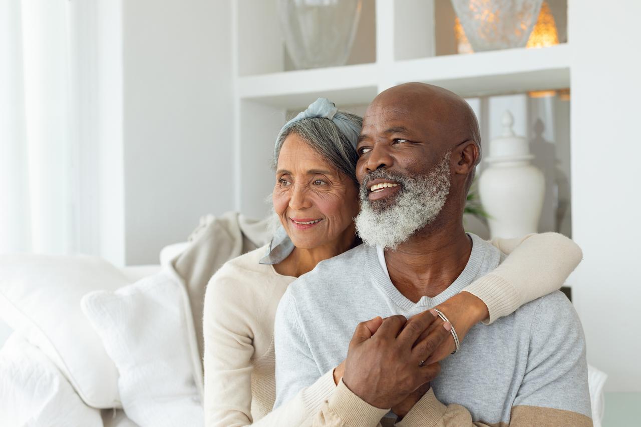 Couple spending time together and laughing on a sofa