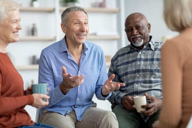 Group of elderly enjoying conversation over coffee